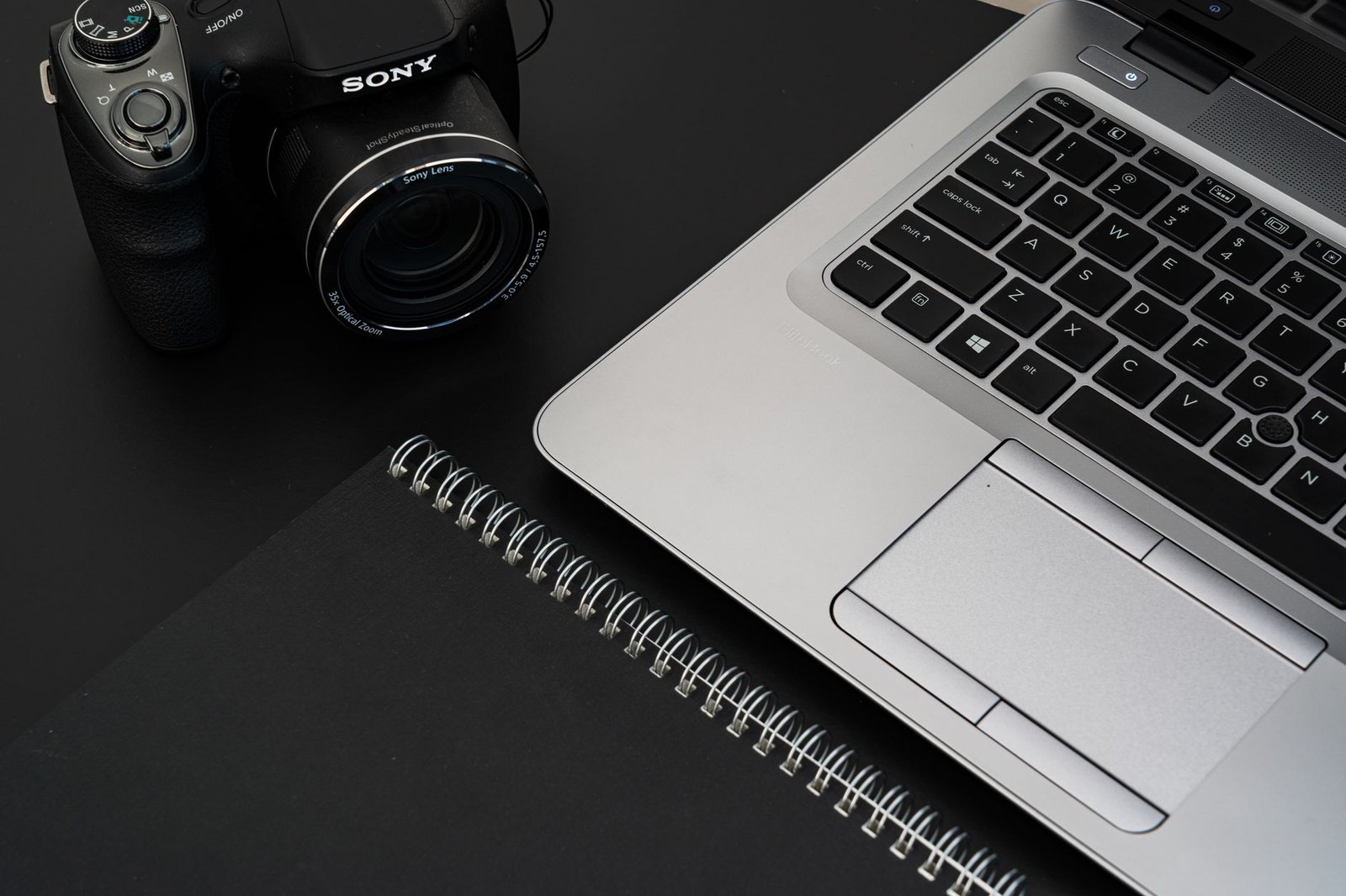 Desk with a laptop and notebook